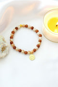 Pulsera Elástica de Piedra Dorada con Charm Flor de Loto 24K